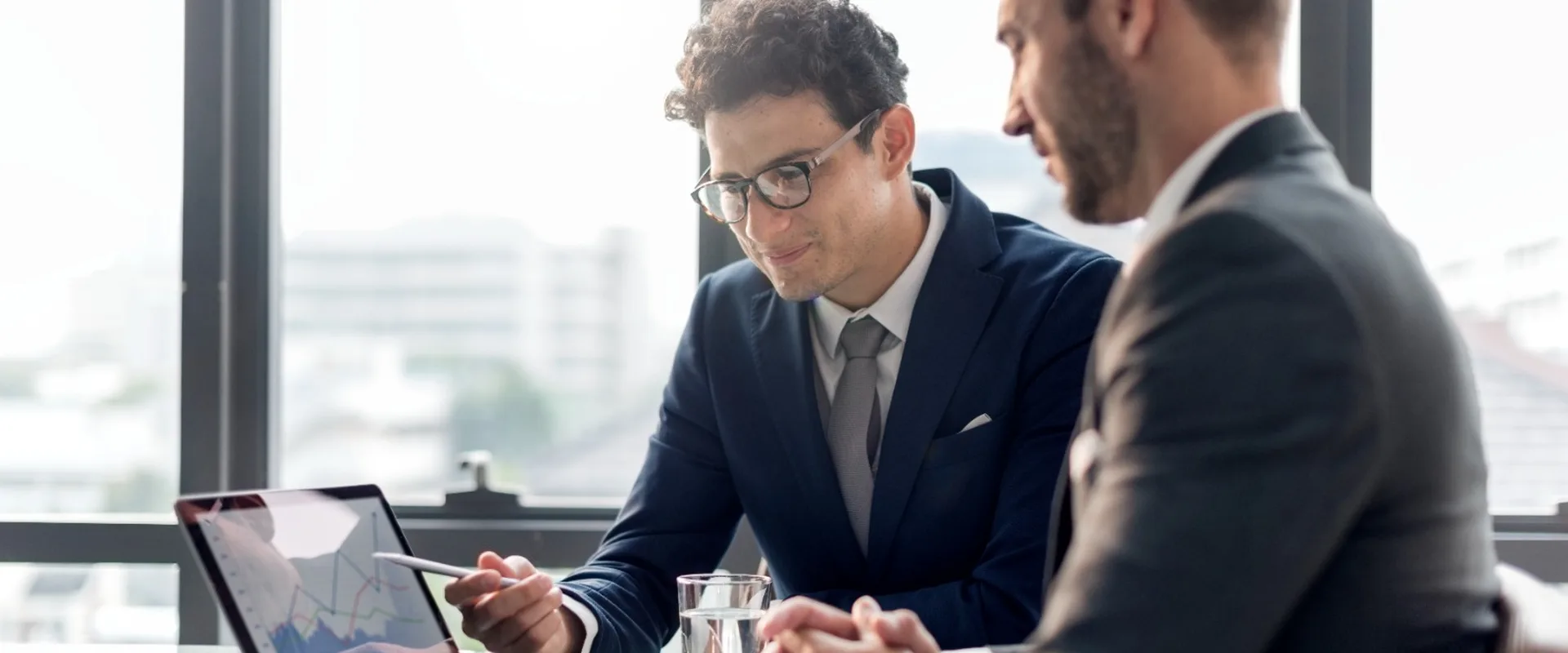 Two advisors discussing legal documents